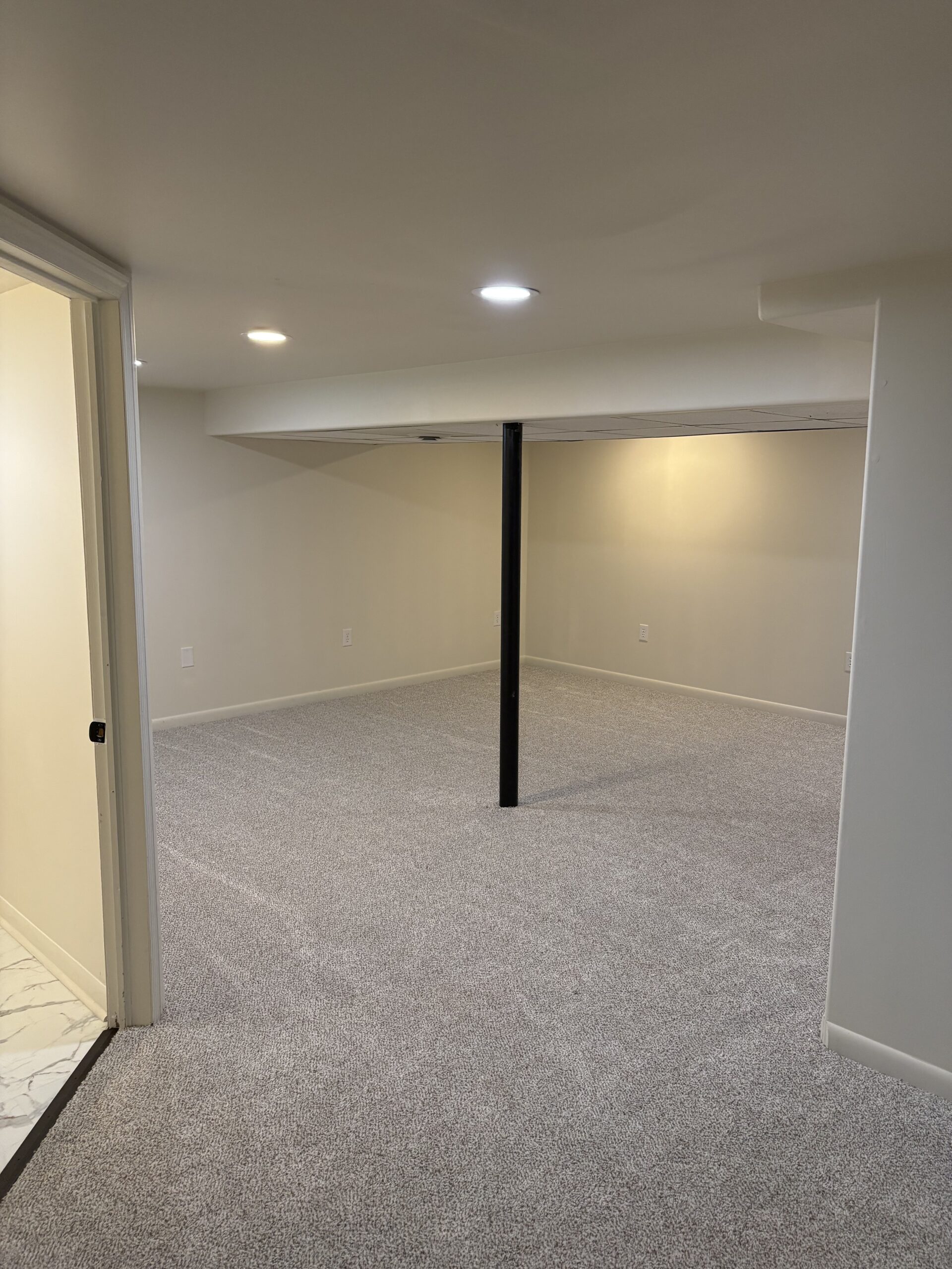 A newly finished basement in Wyoming, Michigan by Ronne Home Solutions, LLC